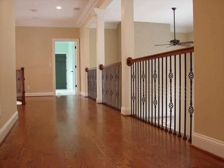 Stair rail with mixed baluster styles