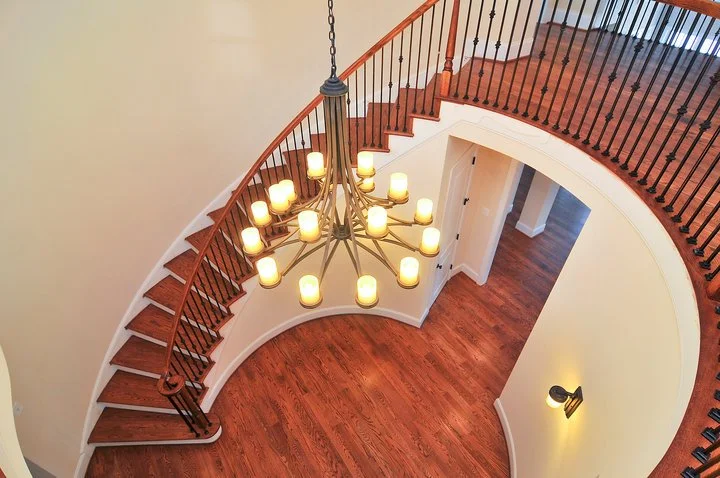Circular stair with metal balusters — balcony view